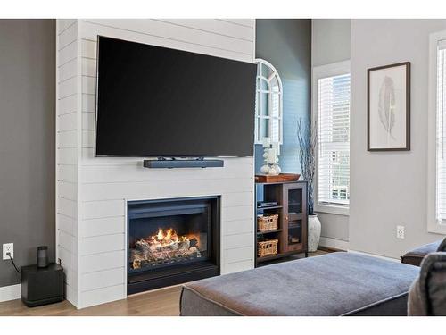 104 Silverado Plains Park Sw, Calgary, AB - Indoor Photo Showing Living Room With Fireplace