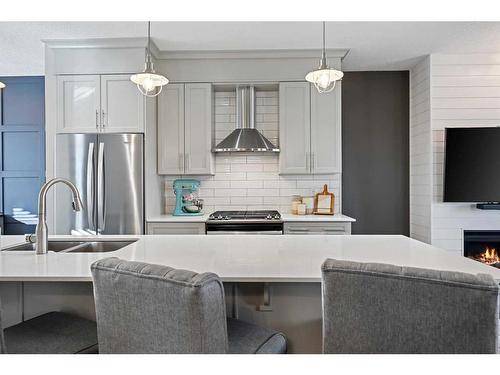 104 Silverado Plains Park Sw, Calgary, AB - Indoor Photo Showing Kitchen With Stainless Steel Kitchen With Double Sink With Upgraded Kitchen