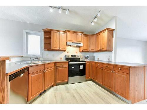 1275 Strathcona Road, Strathmore, AB - Indoor Photo Showing Kitchen With Double Sink