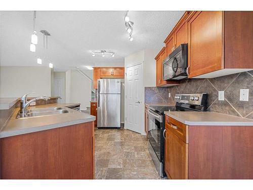 249 Evansmeade Point Nw, Calgary, AB - Indoor Photo Showing Kitchen With Double Sink