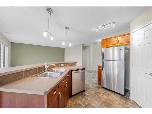 249 Evansmeade Point Nw, Calgary, AB - Indoor Photo Showing Kitchen With Double Sink