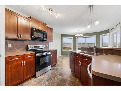 249 Evansmeade Point Nw, Calgary, AB - Indoor Photo Showing Kitchen With Double Sink