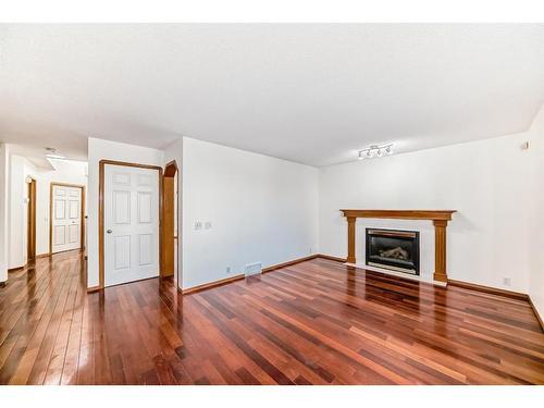 9 Harvest Park Place Ne, Calgary, AB - Indoor Photo Showing Living Room With Fireplace