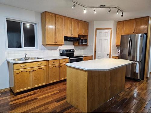 9 Harvest Park Place Ne, Calgary, AB - Indoor Photo Showing Kitchen With Double Sink