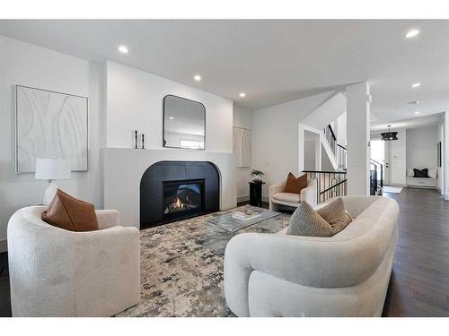 333 Bessborough Drive Sw, Calgary, AB - Indoor Photo Showing Living Room With Fireplace