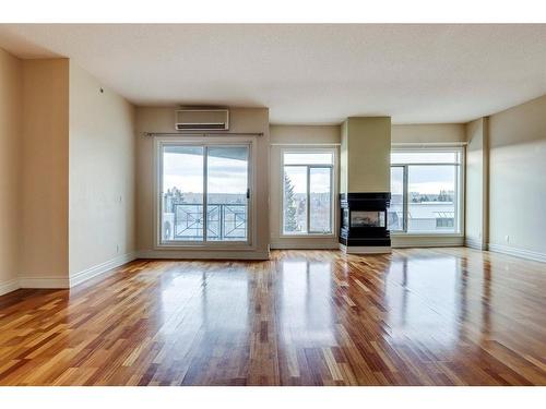 502-4 14 Street Nw, Calgary, AB - Indoor Photo Showing Living Room With Fireplace