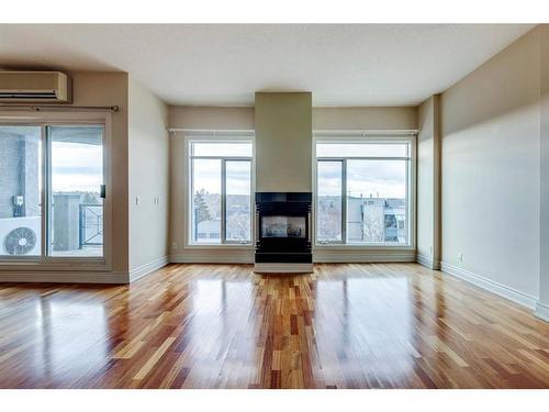 502-4 14 Street Nw, Calgary, AB - Indoor Photo Showing Living Room With Fireplace