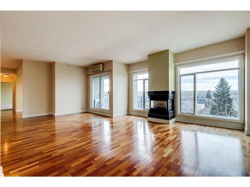 502-4 14 Street Nw, Calgary, AB - Indoor Photo Showing Living Room With Fireplace