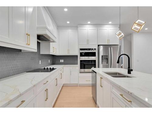 44 Auburn Glen Lane Se, Calgary, AB - Indoor Photo Showing Kitchen With Stainless Steel Kitchen With Double Sink With Upgraded Kitchen