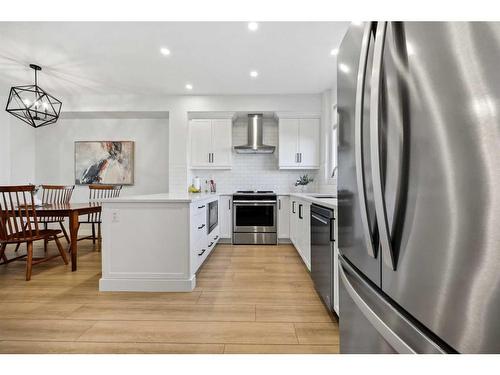 96 Magnolia Grove Se, Calgary, AB - Indoor Photo Showing Kitchen With Stainless Steel Kitchen With Upgraded Kitchen