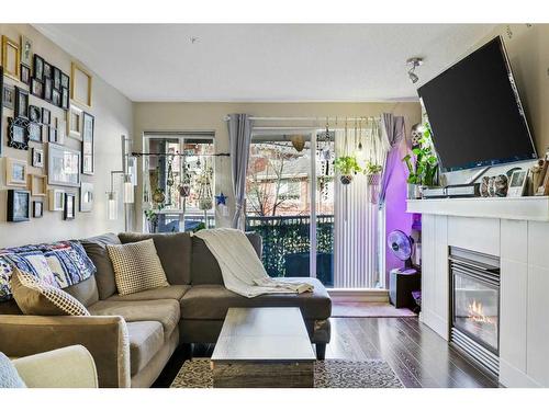 322-5115 Richard Road Sw, Calgary, AB - Indoor Photo Showing Living Room With Fireplace