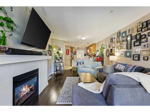 322-5115 Richard Road Sw, Calgary, AB - Indoor Photo Showing Living Room With Fireplace