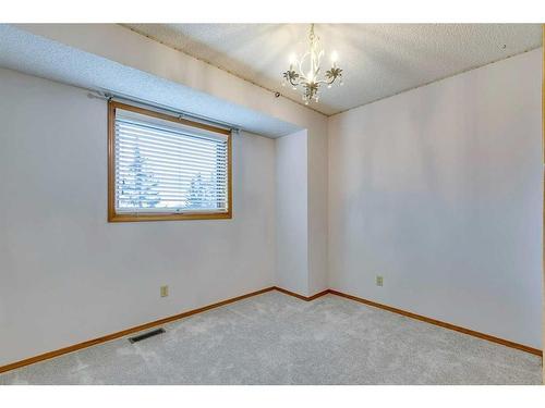 107 Hawkmount Close Nw, Calgary, AB - Indoor Photo Showing Other Room