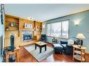 107 Hawkmount Close Nw, Calgary, AB  - Indoor Photo Showing Living Room With Fireplace 