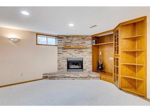 107 Hawkmount Close Nw, Calgary, AB - Indoor With Fireplace