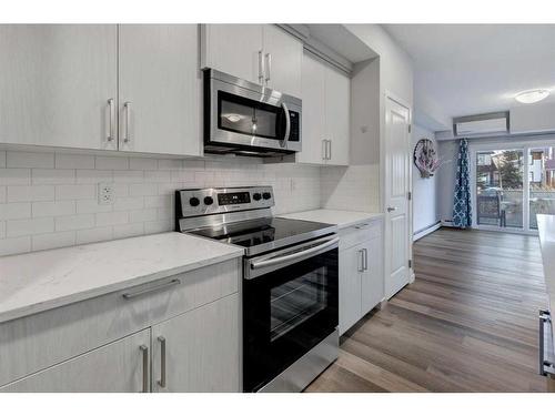 106-300 Harvest Hills Place Ne, Calgary, AB - Indoor Photo Showing Kitchen With Stainless Steel Kitchen With Upgraded Kitchen