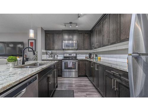 805 Evanston Manor Nw, Calgary, AB - Indoor Photo Showing Kitchen With Double Sink With Upgraded Kitchen