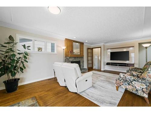 226 Midridge Crescent Se, Calgary, AB - Indoor Photo Showing Living Room With Fireplace