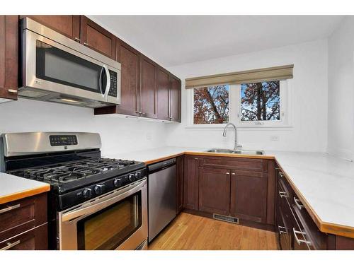 4921 54 Avenue, Olds, AB - Indoor Photo Showing Kitchen With Double Sink