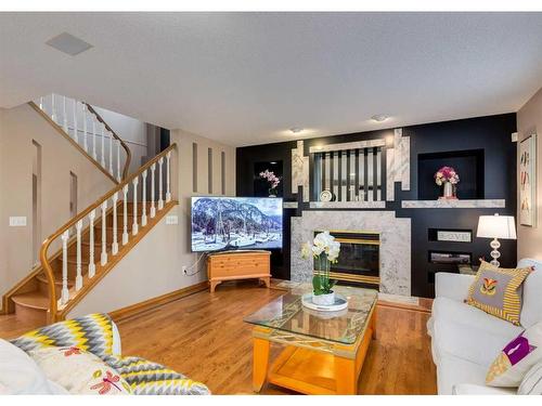 122 Douglasview Rise Se, Calgary, AB - Indoor Photo Showing Living Room With Fireplace