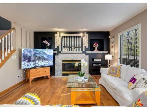 122 Douglasview Rise Se, Calgary, AB - Indoor Photo Showing Living Room With Fireplace