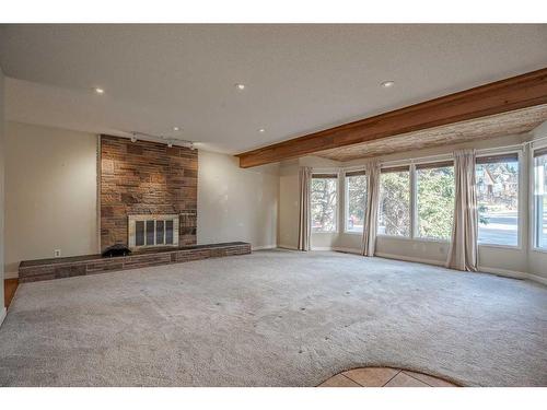 3235 Conrad Crescent Nw, Calgary, AB - Indoor With Fireplace