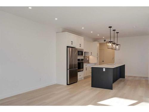 1301-55 Lucas Way Nw, Calgary, AB - Indoor Photo Showing Kitchen With Stainless Steel Kitchen