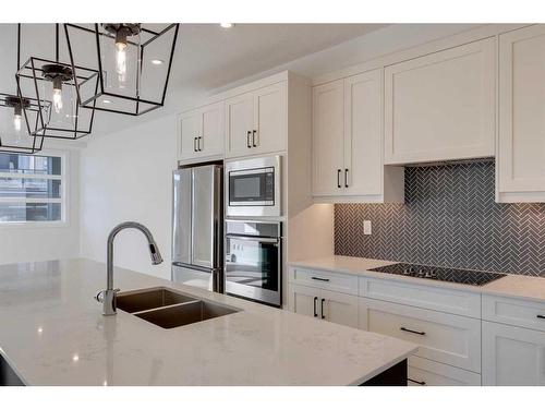 1301-55 Lucas Way Nw, Calgary, AB - Indoor Photo Showing Kitchen With Double Sink With Upgraded Kitchen