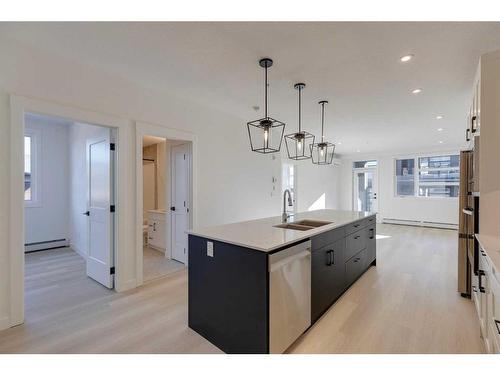 1301-55 Lucas Way Nw, Calgary, AB - Indoor Photo Showing Kitchen With Double Sink With Upgraded Kitchen