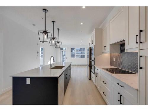 1301-55 Lucas Way Nw, Calgary, AB - Indoor Photo Showing Kitchen With Double Sink With Upgraded Kitchen