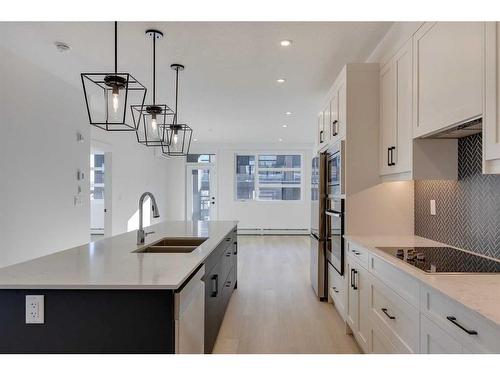 1301-55 Lucas Way Nw, Calgary, AB - Indoor Photo Showing Kitchen With Double Sink With Upgraded Kitchen