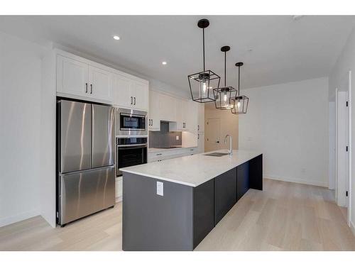 1301-55 Lucas Way Nw, Calgary, AB - Indoor Photo Showing Kitchen With Stainless Steel Kitchen