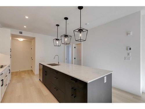 1301-55 Lucas Way Nw, Calgary, AB - Indoor Photo Showing Kitchen With Double Sink With Upgraded Kitchen