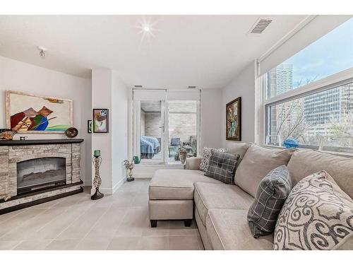 202-303 13 Avenue Sw, Calgary, AB - Indoor Photo Showing Living Room With Fireplace