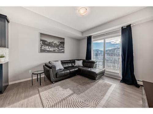 220-4350 Seton Drive Se, Calgary, AB - Indoor Photo Showing Living Room