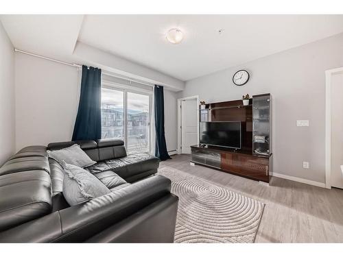 220-4350 Seton Drive Se, Calgary, AB - Indoor Photo Showing Living Room