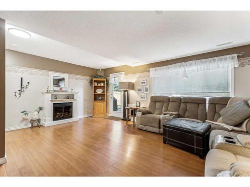 130 Hidden Valley Crescent Nw, Calgary, AB - Indoor Photo Showing Living Room With Fireplace