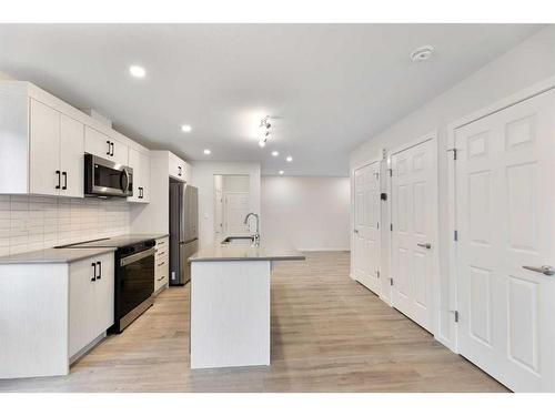 1017 Southwinds Greens Sw, Airdrie, AB - Indoor Photo Showing Kitchen