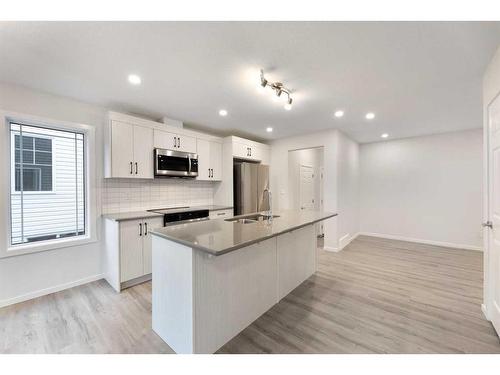 1017 Southwinds Greens Sw, Airdrie, AB - Indoor Photo Showing Kitchen With Upgraded Kitchen