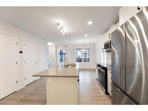 1017 Southwinds Greens Sw, Airdrie, AB - Indoor Photo Showing Kitchen