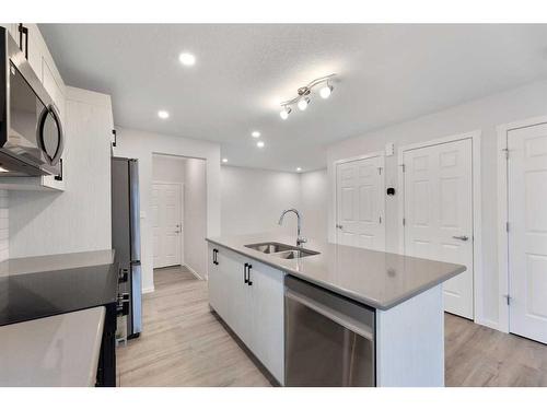 1017 Southwinds Greens Sw, Airdrie, AB - Indoor Photo Showing Kitchen With Double Sink