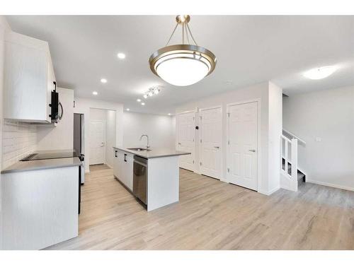 1017 Southwinds Greens Sw, Airdrie, AB - Indoor Photo Showing Kitchen