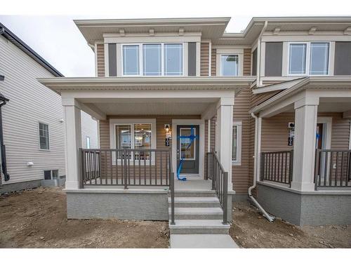 1017 Southwinds Greens Sw, Airdrie, AB - Outdoor With Deck Patio Veranda With Facade