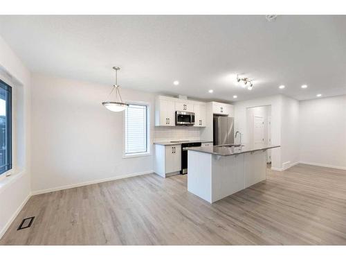 1017 Southwinds Greens Sw, Airdrie, AB - Indoor Photo Showing Kitchen With Upgraded Kitchen