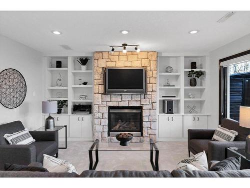 65 Springborough Boulevard Sw, Calgary, AB - Indoor Photo Showing Living Room With Fireplace