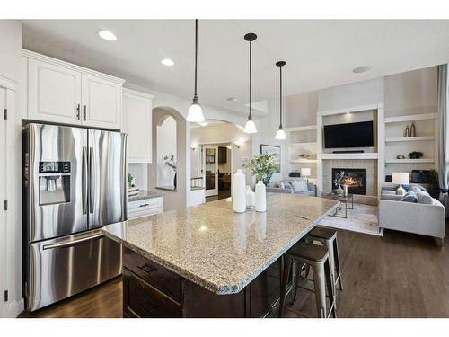 65 Springborough Boulevard Sw, Calgary, AB - Indoor Photo Showing Kitchen With Fireplace With Stainless Steel Kitchen With Upgraded Kitchen