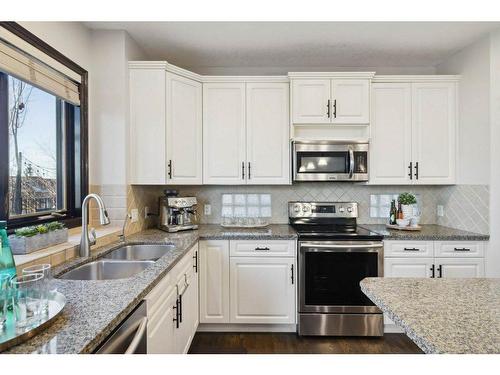 65 Springborough Boulevard Sw, Calgary, AB - Indoor Photo Showing Kitchen With Stainless Steel Kitchen With Double Sink