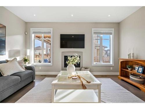 44 Windford Park Sw, Airdrie, AB - Indoor Photo Showing Living Room With Fireplace