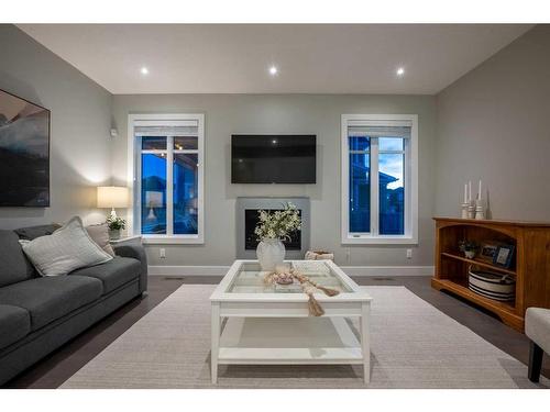 44 Windford Park Sw, Airdrie, AB - Indoor Photo Showing Living Room With Fireplace