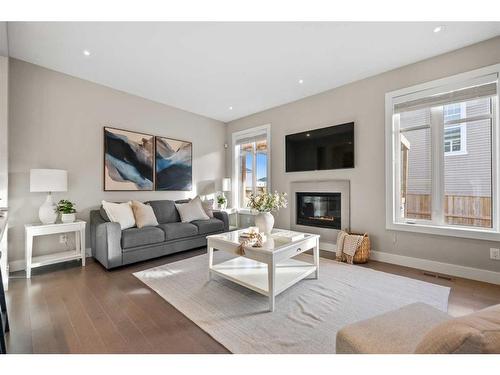 44 Windford Park Sw, Airdrie, AB - Indoor Photo Showing Living Room With Fireplace